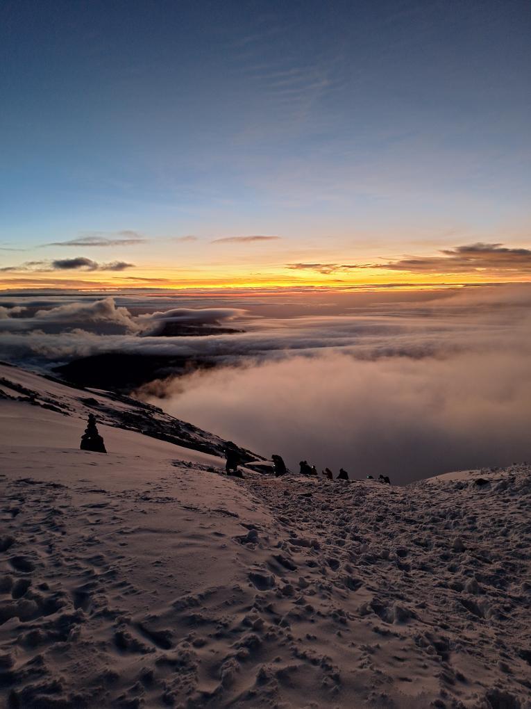 Sunrise view above clouds on Mount Kilimanjaro summit